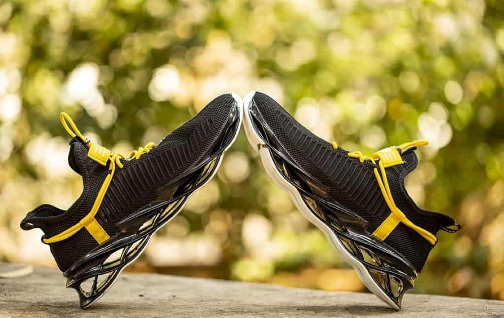 yellow and black sneakers in a flat surface